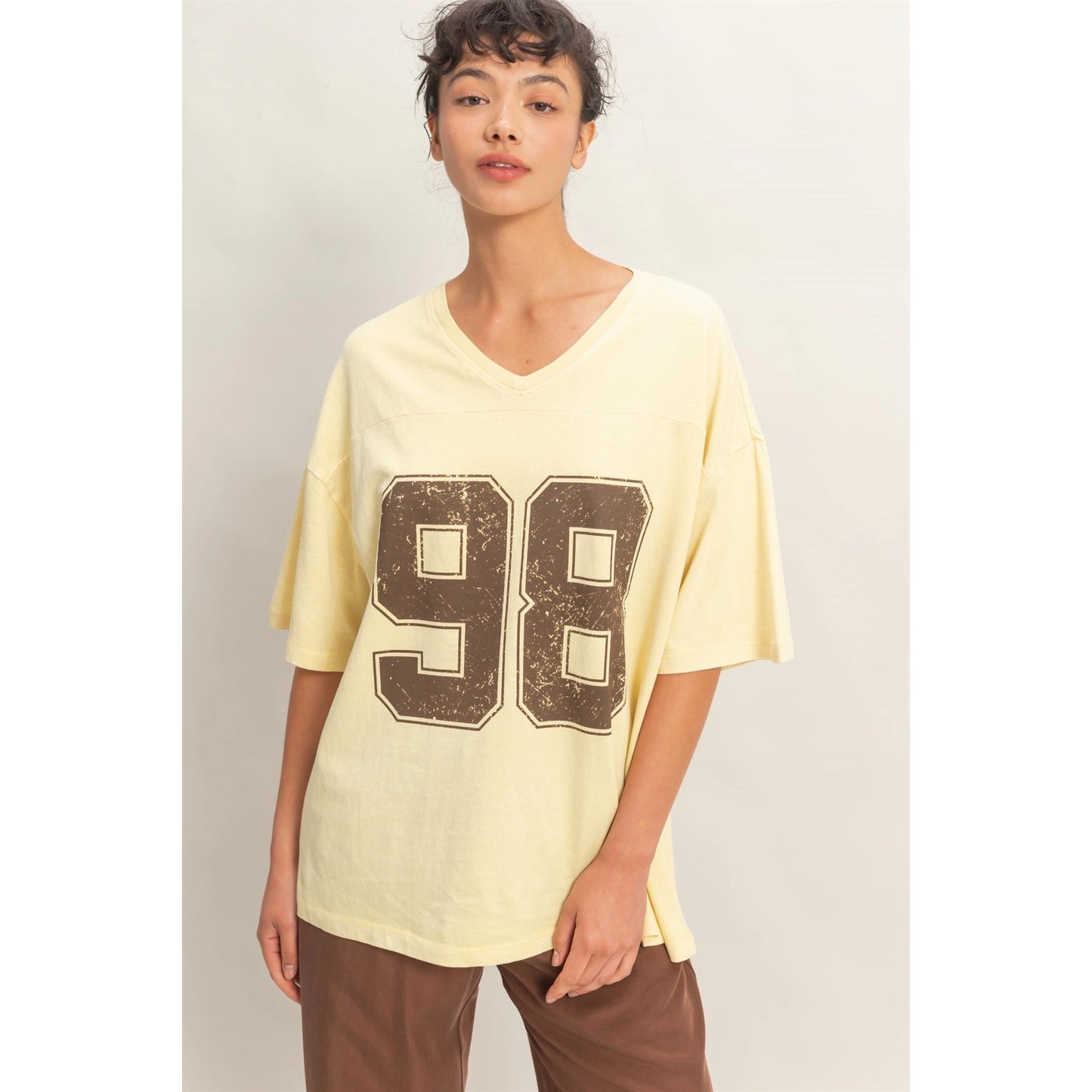 Oversized Varsity Style V-Neck Graphic T-Shirt