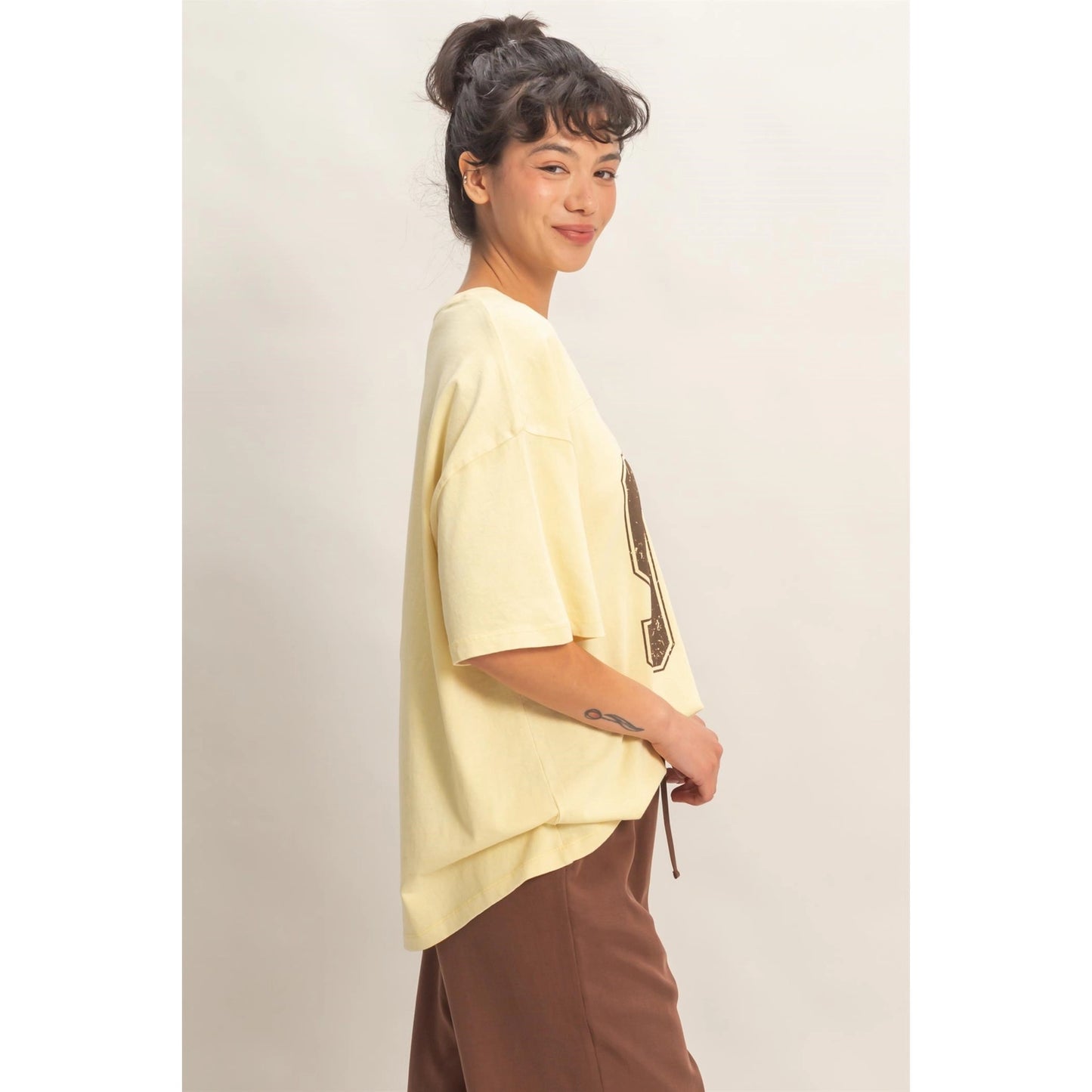 Oversized Varsity Style V-Neck Graphic T-Shirt