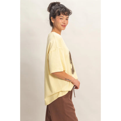 Oversized Varsity Style V-Neck Graphic T-Shirt